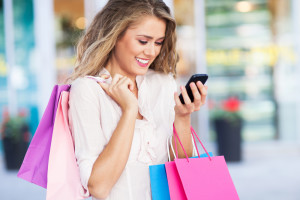 Woman shopping and using her phone