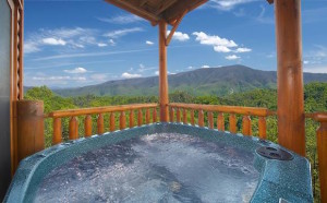 Photo of a hot tub on the deck of a Sevierville TN cabin rental with mountain views.